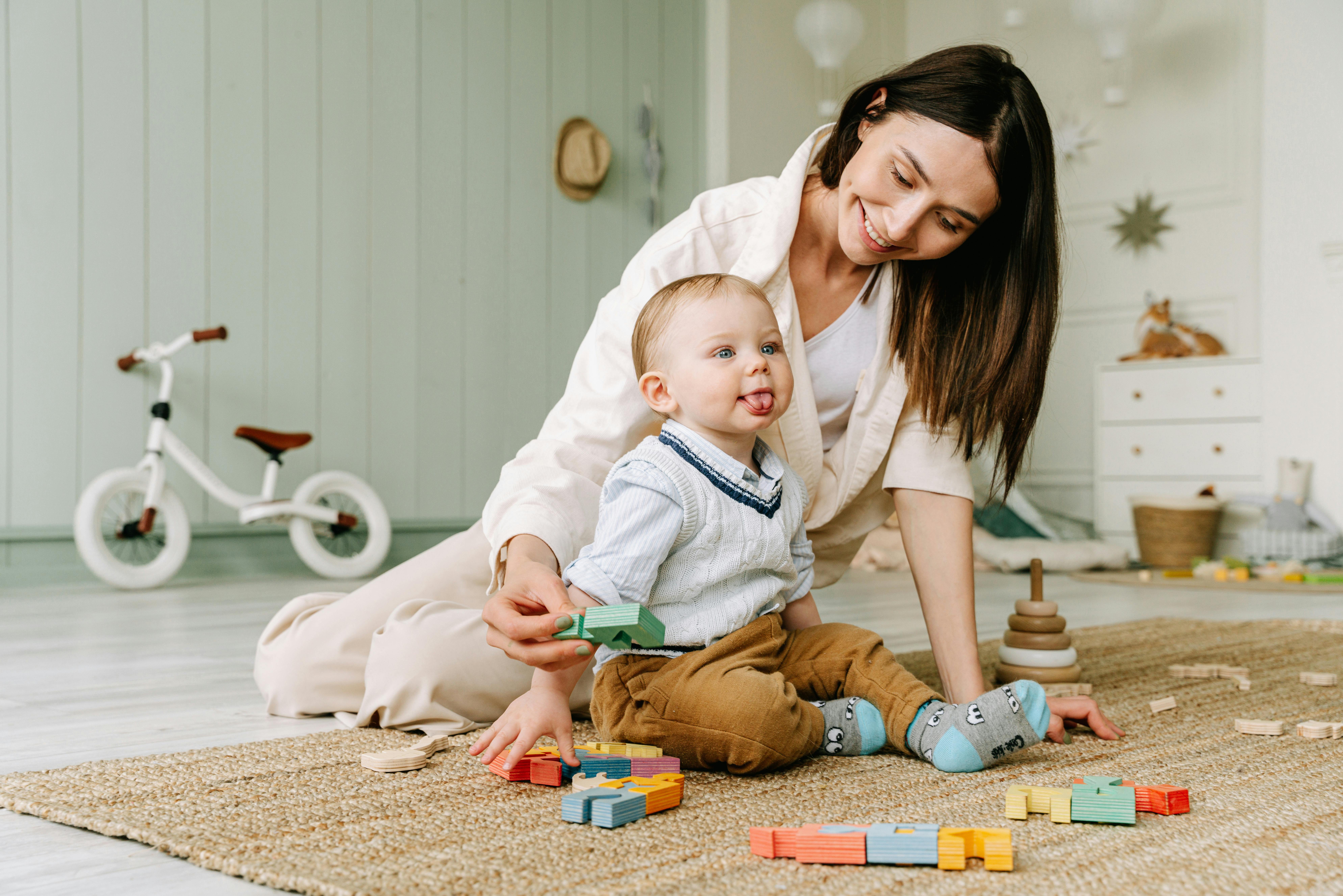 Caring Babysitter Engaging a Child in Playful Learning
